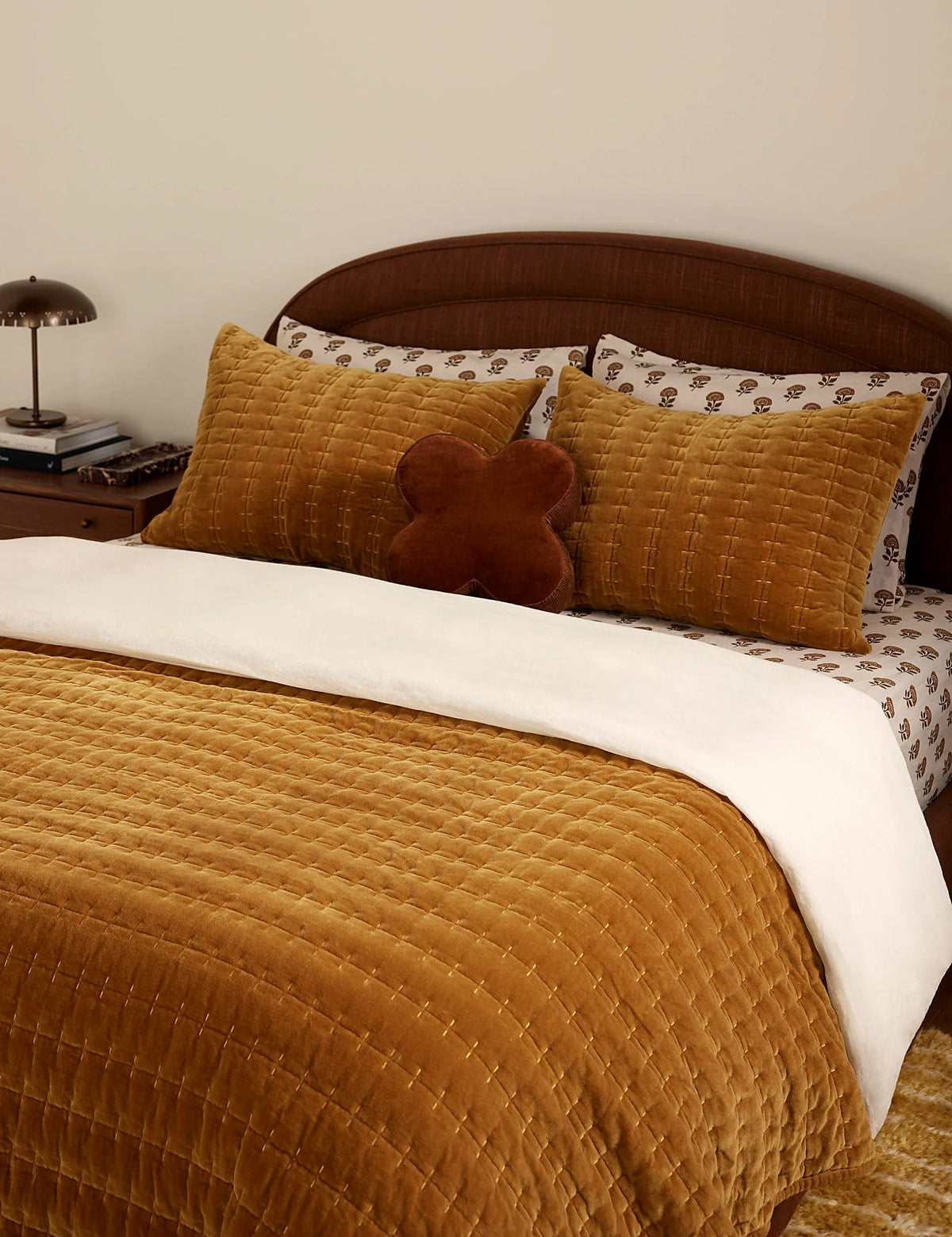 Marigold velvet quilt in full queen size on a made bed