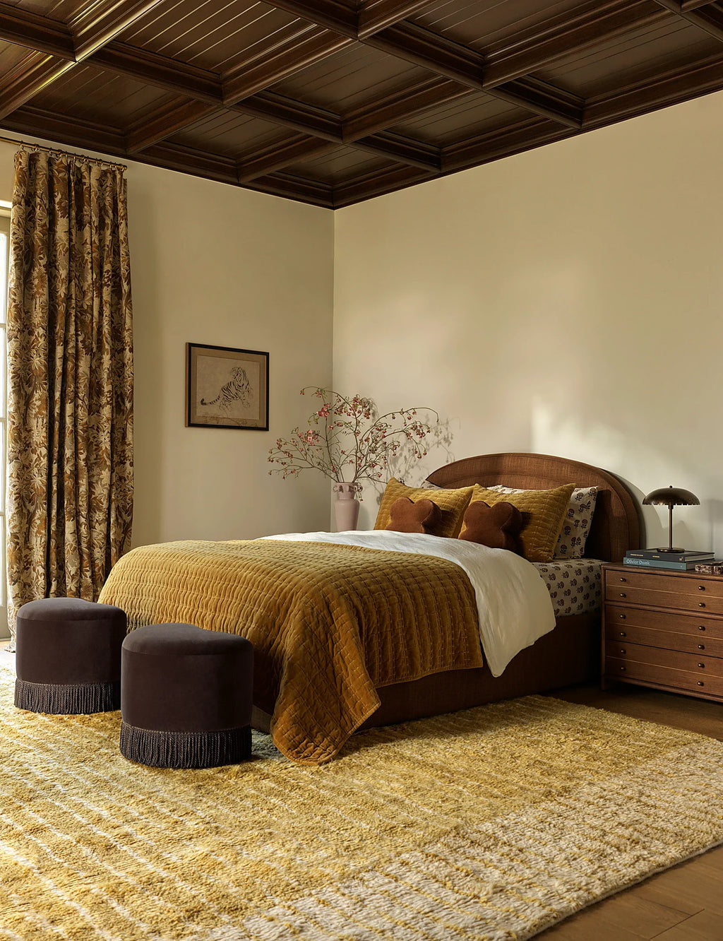 Bedroom with a velvet quilt pulled up across the bed