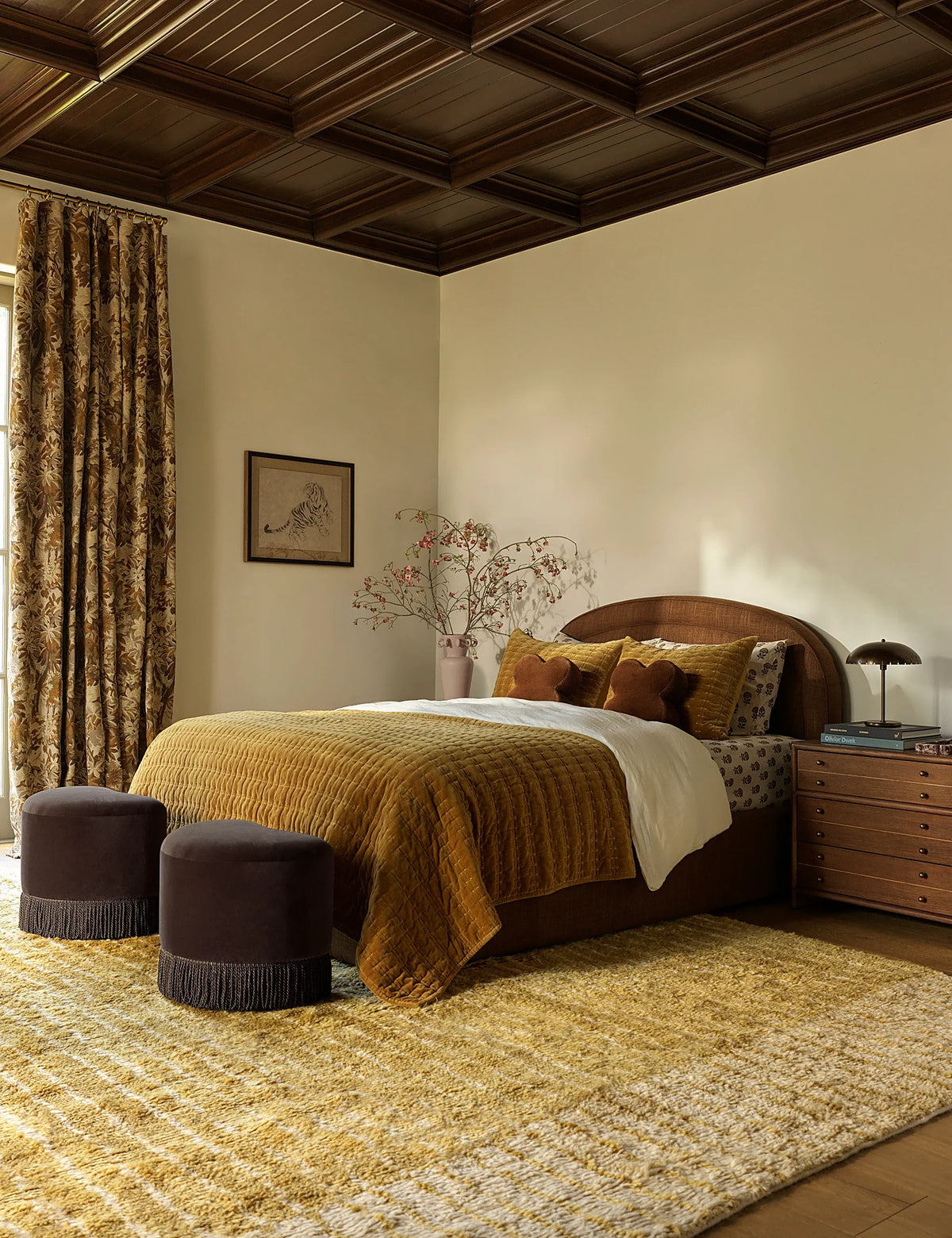 Bedroom with a velvet quilt pulled up across the bed