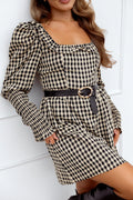 Front view of a black gingham mini dress with a frilled scoop neckline